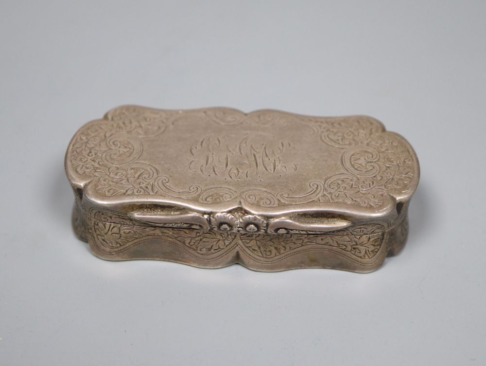 A late Victorian engraved silver shaped oval snuff box, Colen Hewer Cheshire, Birmingham, 1893, 82mm, 89.4 grams.